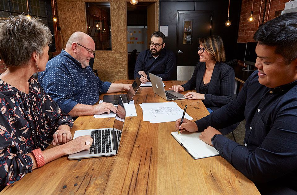 Eatscape design team working at table